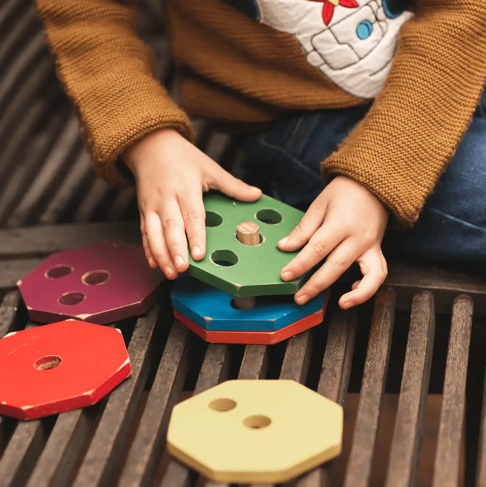 Autistic child playing with building blocks